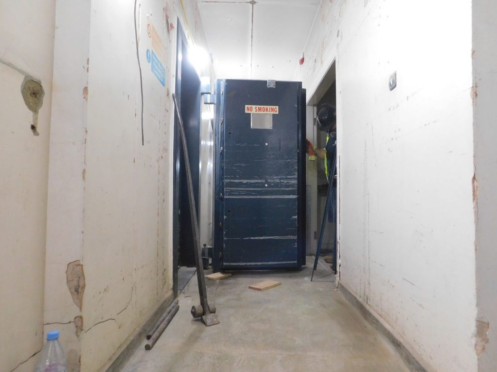 Blue vault door to be removed in corridor